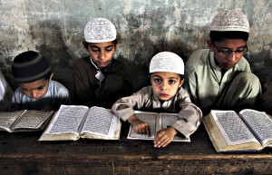 Pakistani Muslim students attend a religious madrassa, or school